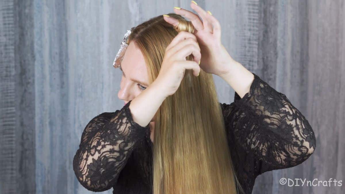 sectioning hair to curl and wrap in foil