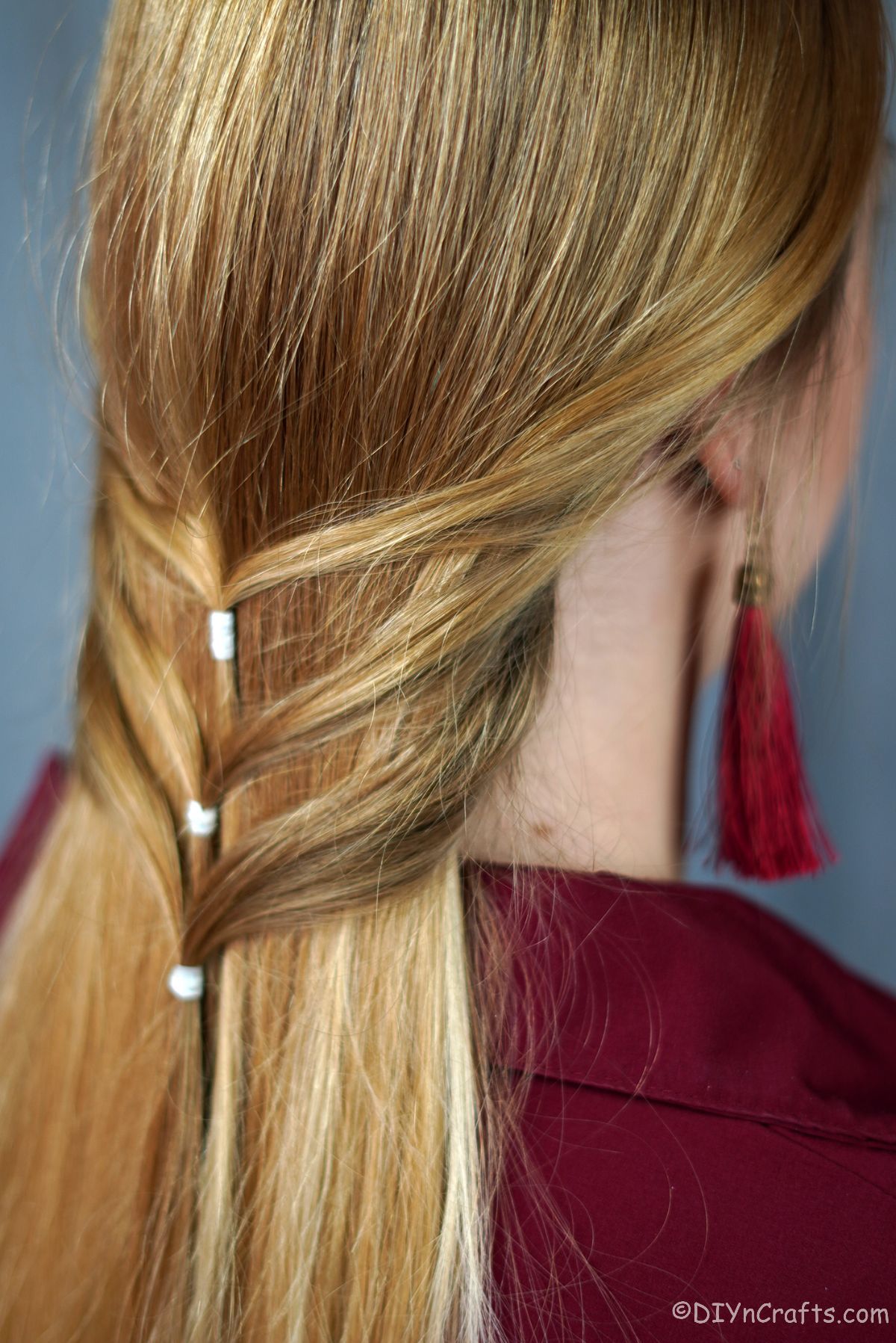 three waterfall braid on back of blonde hair
