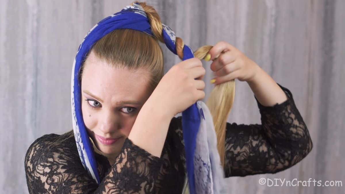 hair being wrapped around blue scarf