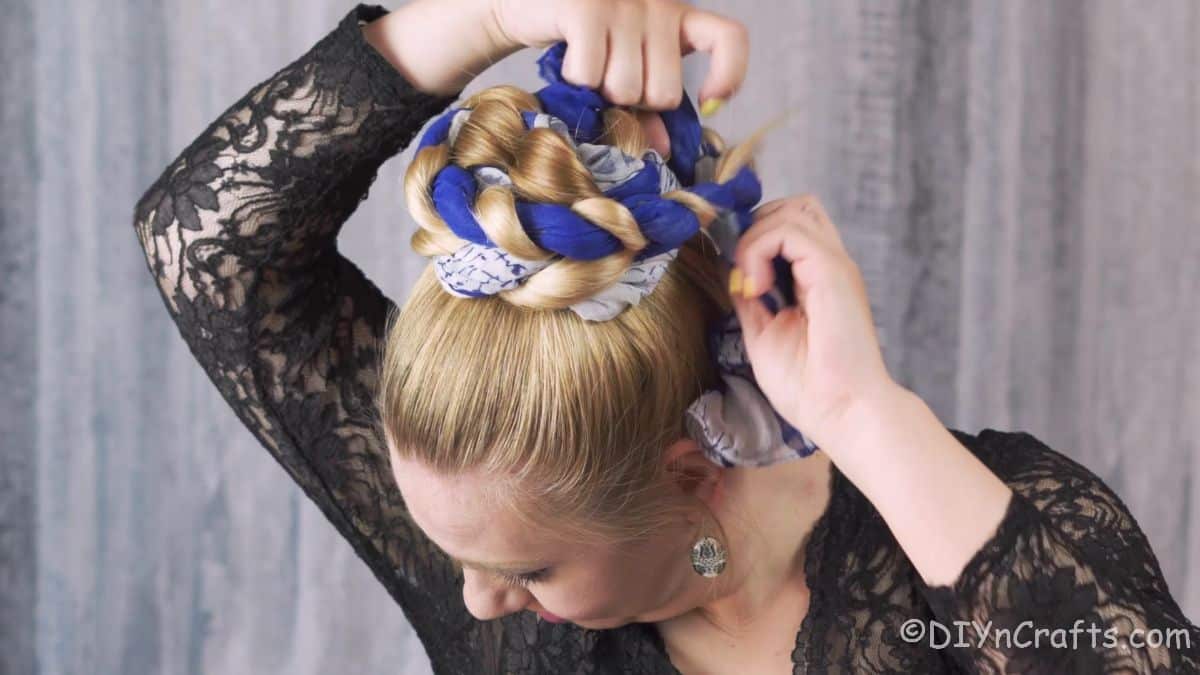 scarf wrapped in hair being turned into a bun