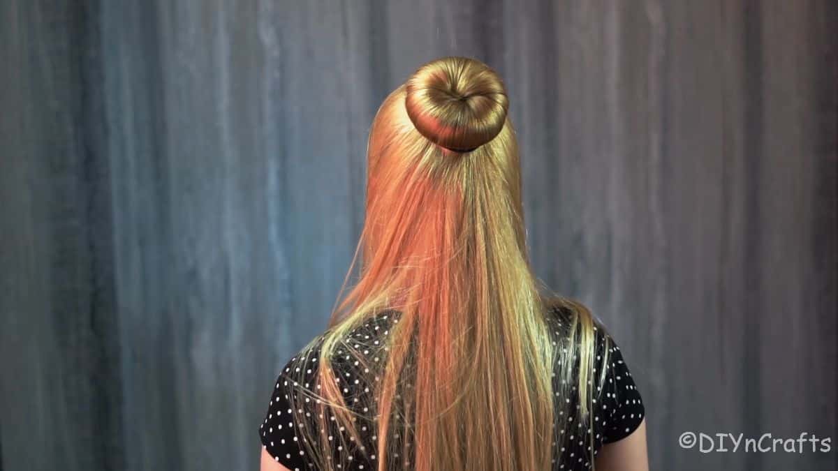 hair hanging around the hair donut