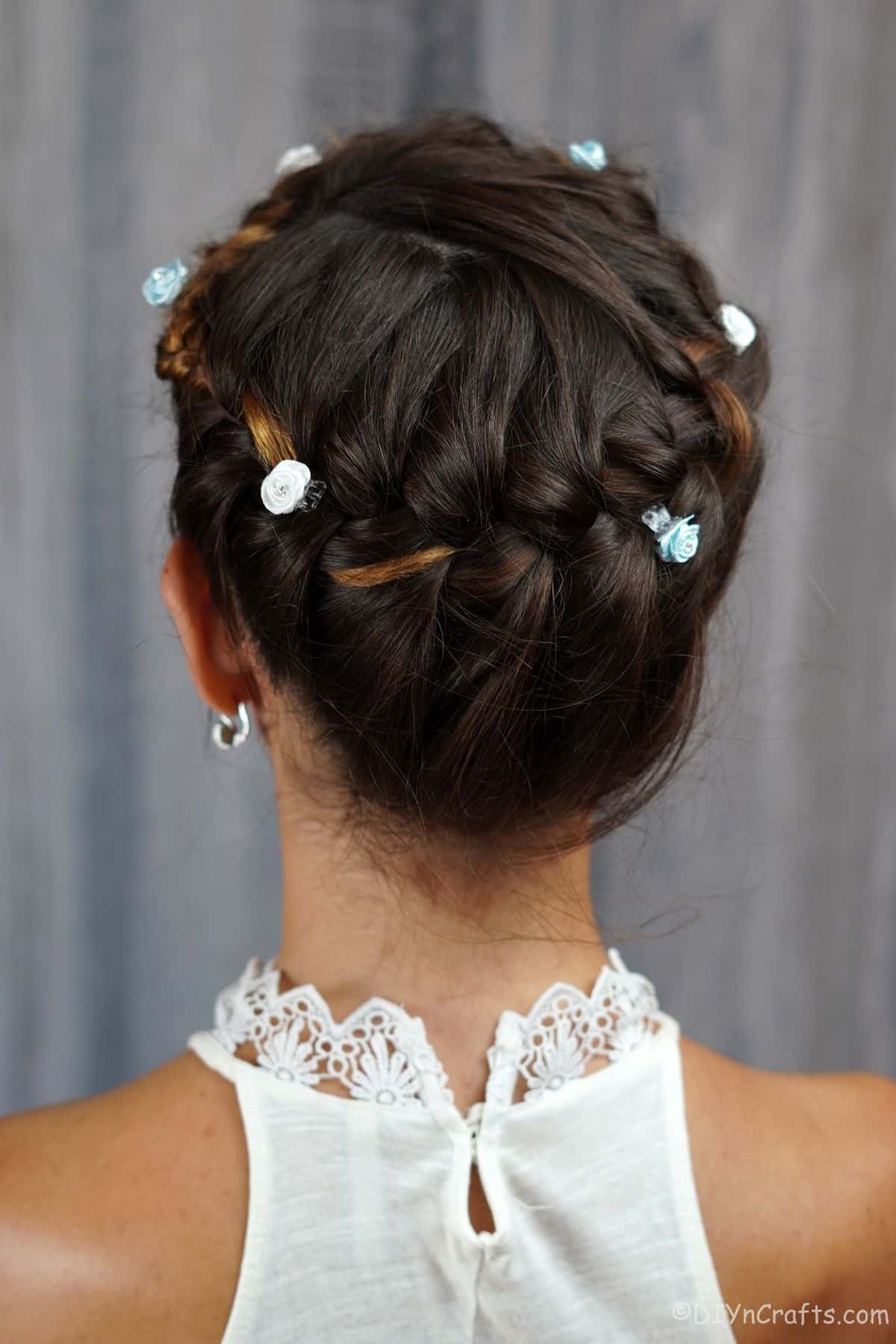 back of french braid crown on brunette in white shirt