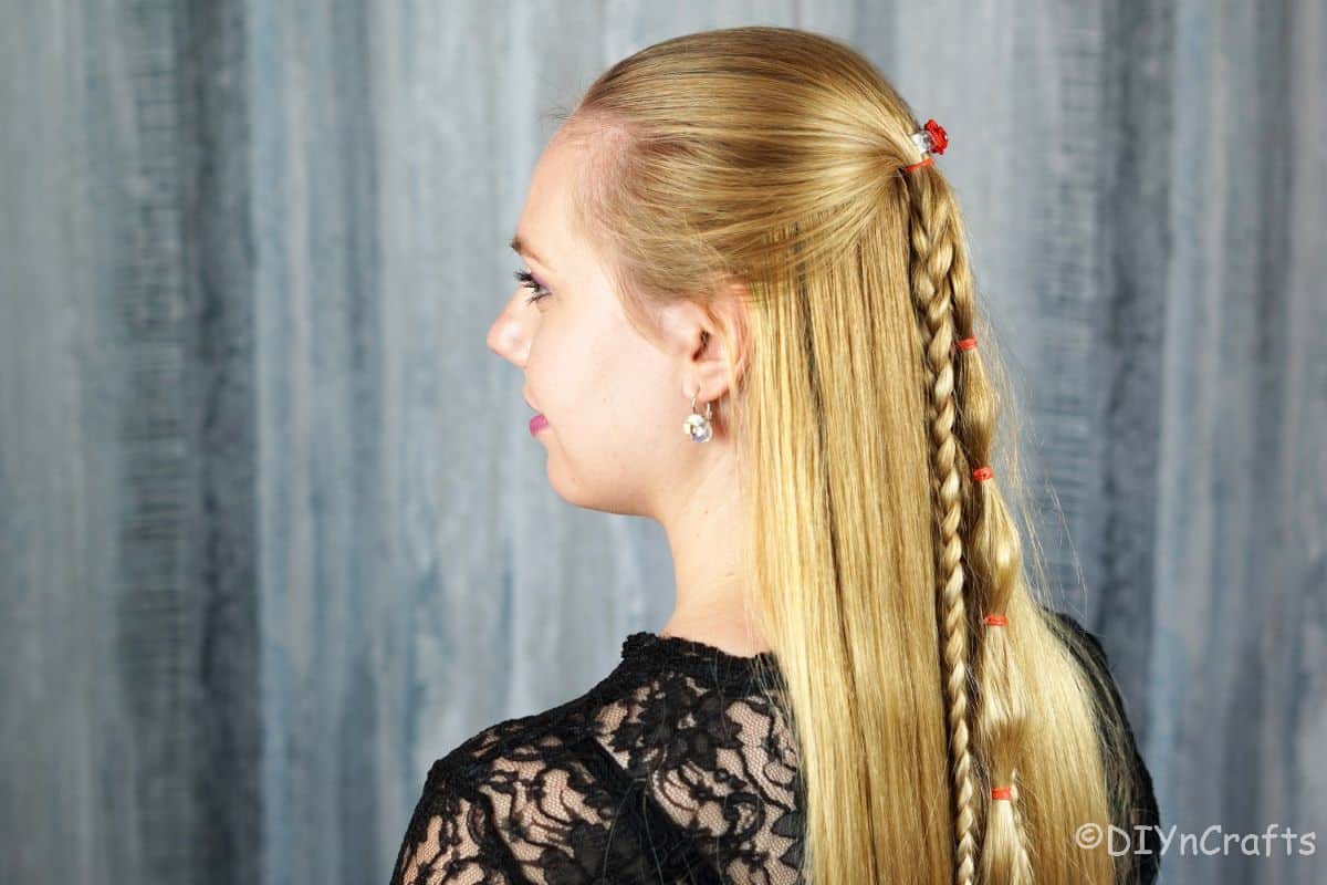 side of the viking style braids on a half up half down hairstyle