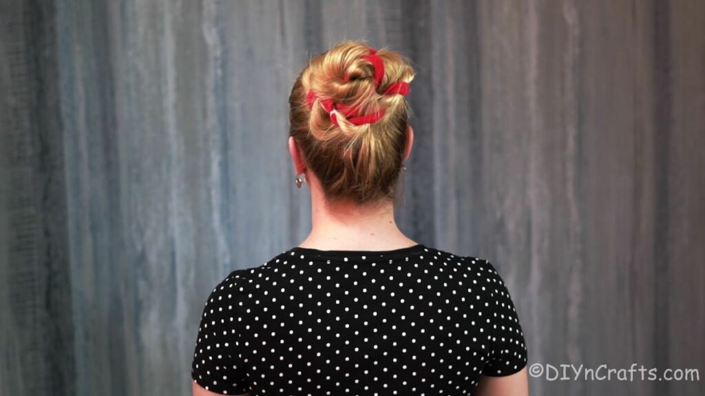 high twisted bun with ribbon from back