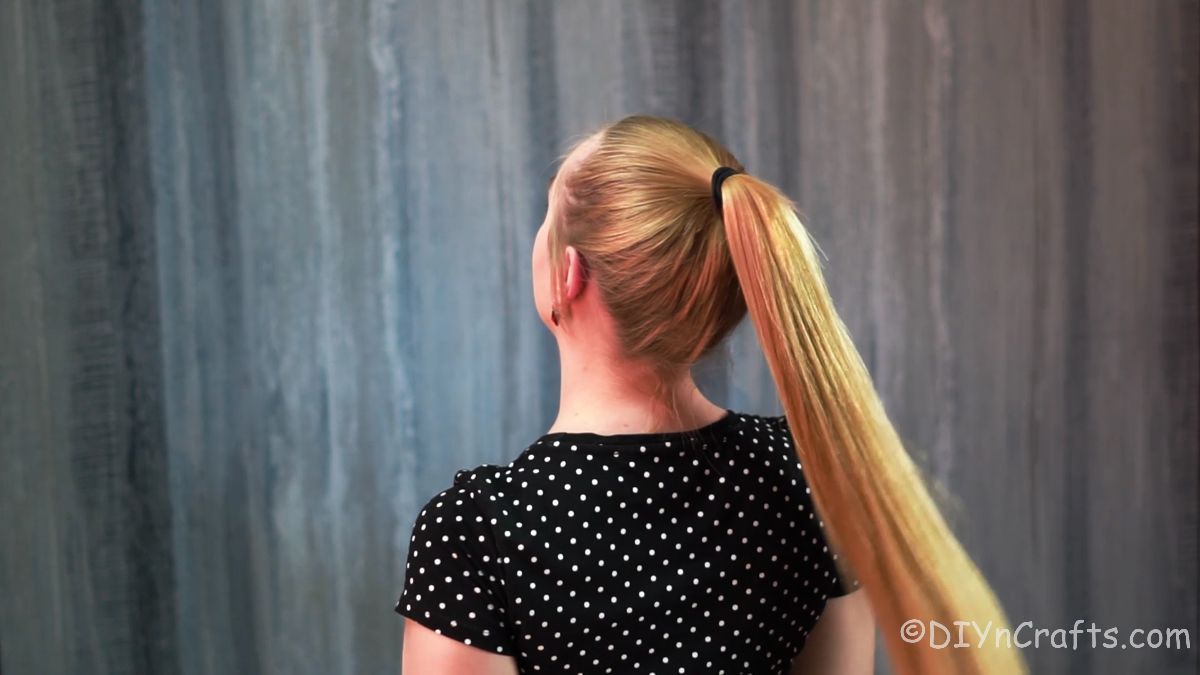 blonde woman in high ponytail