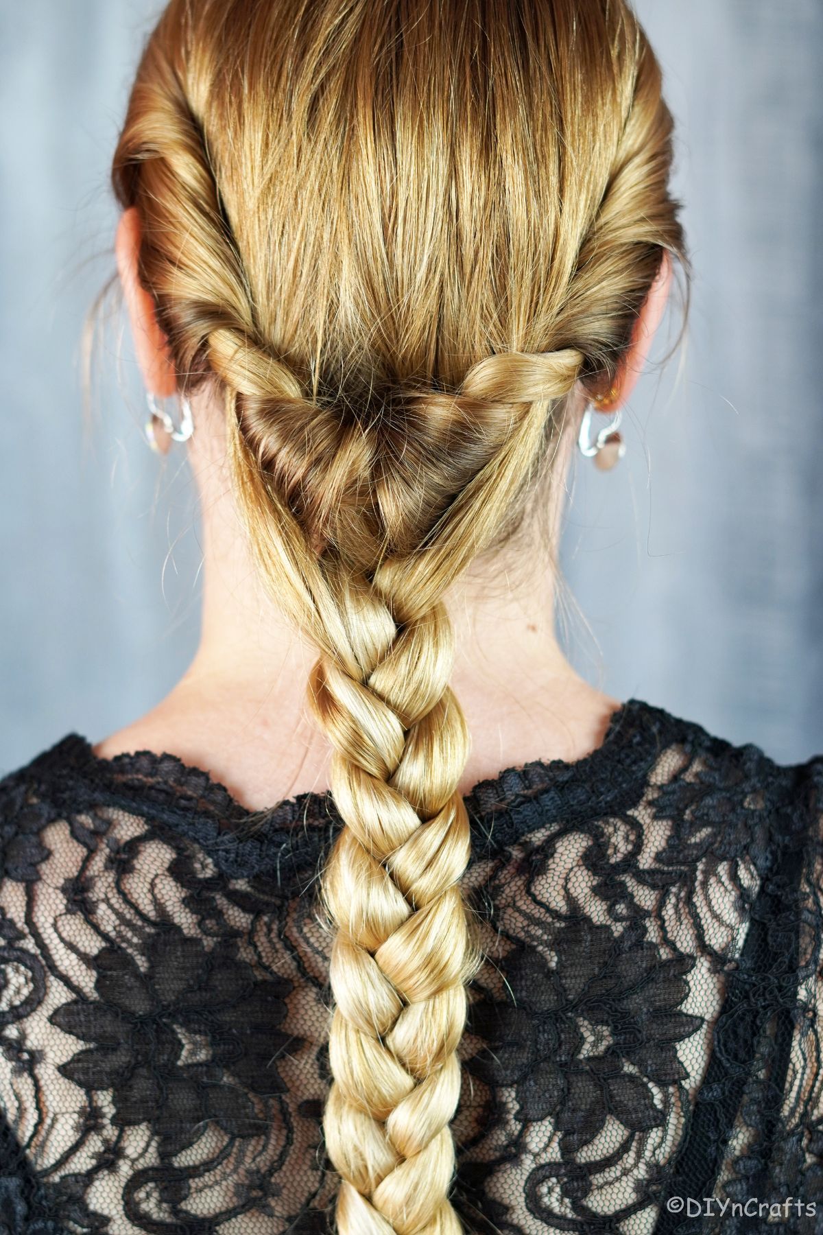 braided low ponytail on woman with blonde hair