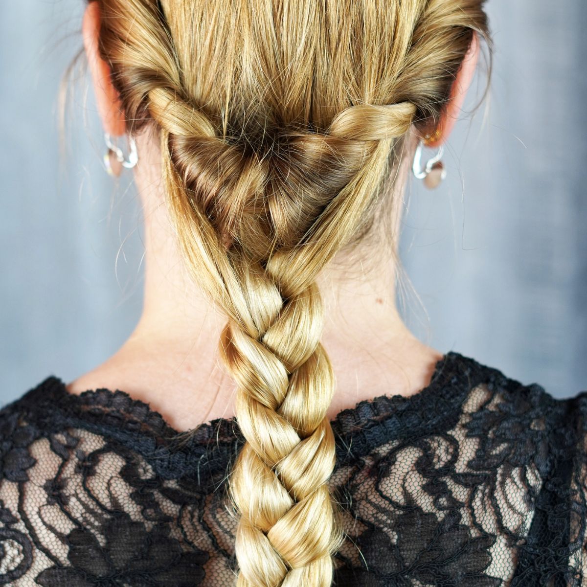 Image of Low ponytail with braids for long blonde hair