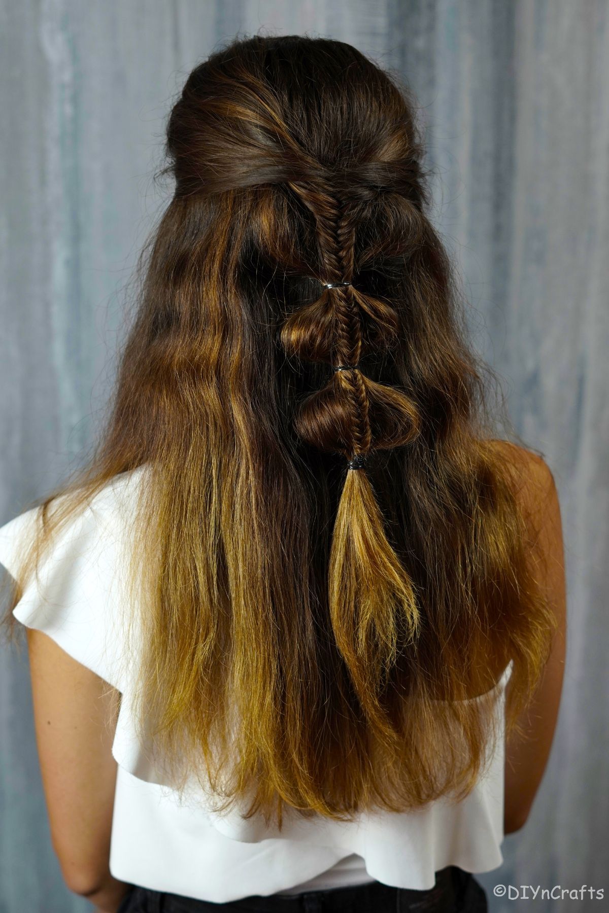 palm tree bubble braid on back of brunettes head