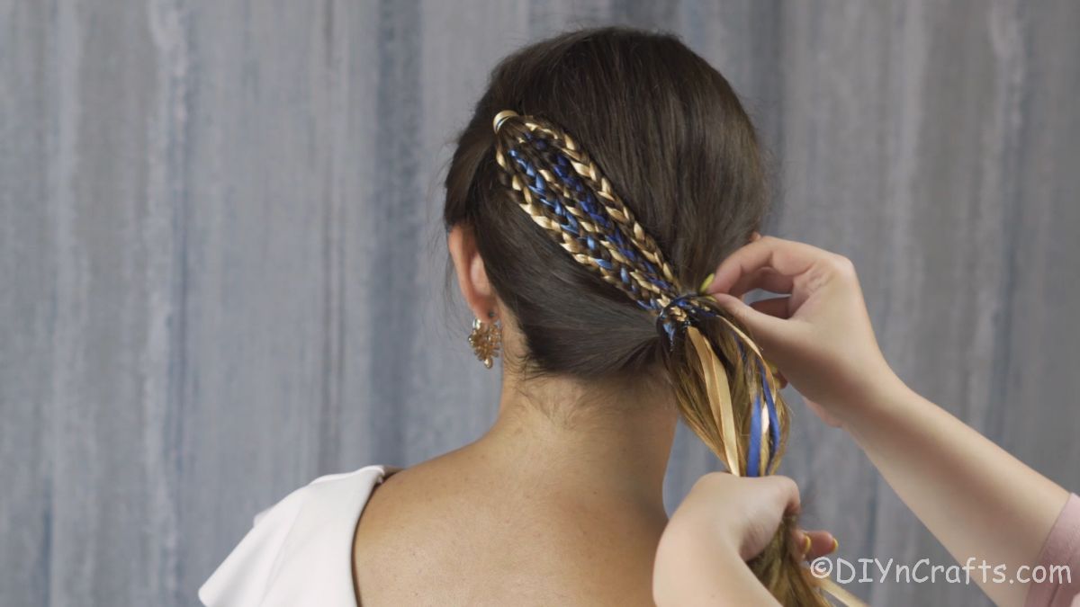 Making a side ponytail with braided section