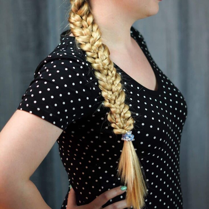 woman in black shirt with long braid