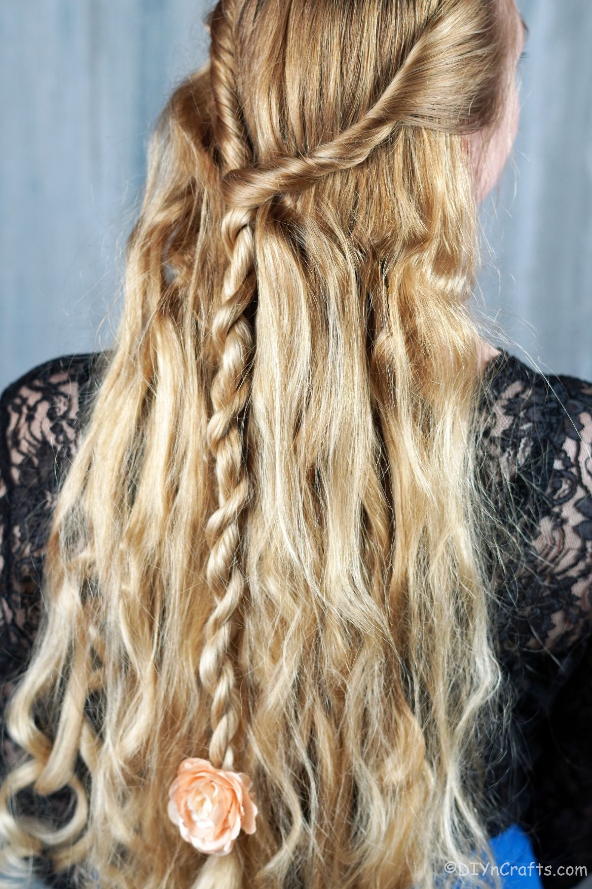 braid hanging down back of half up hairstyle