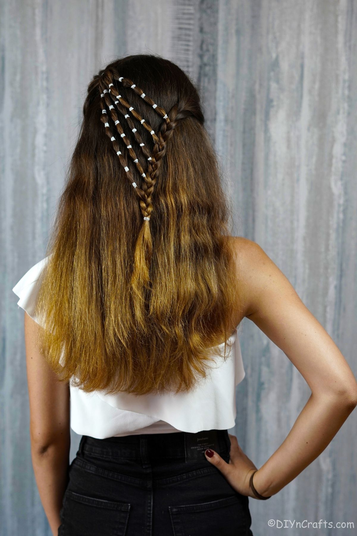 back of waterfall braid on woman with brown hair