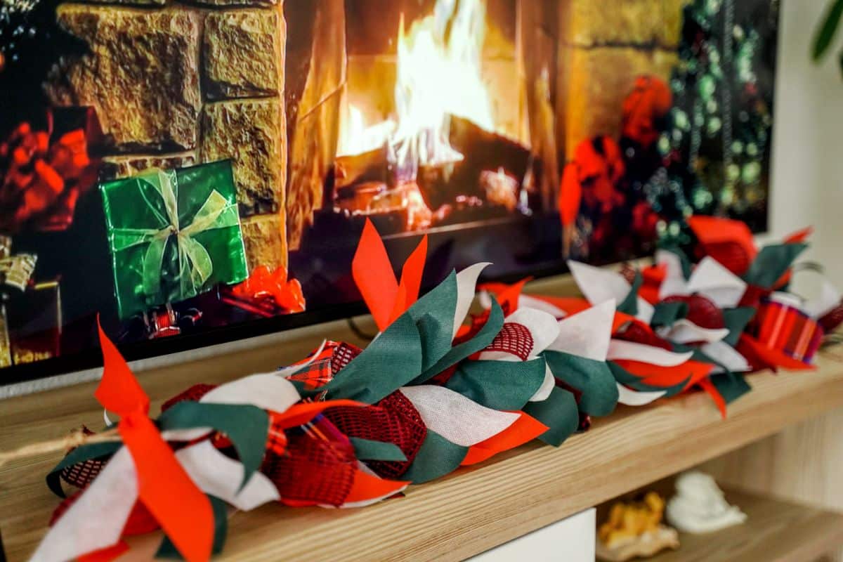 Christmas rag garland on shelf in front of fireplace