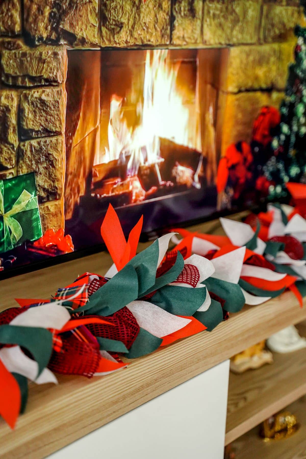 Christmas garland in front of fireplace