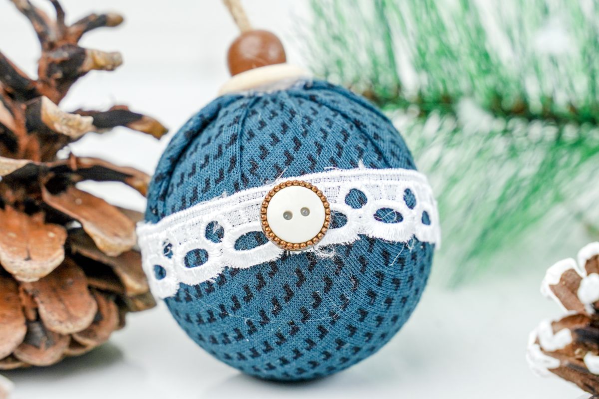 blue checked fabric ball Christmas ornament on table by pinceone