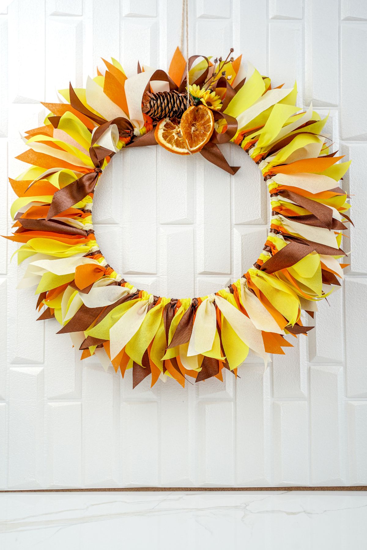wreath hanging on white wall