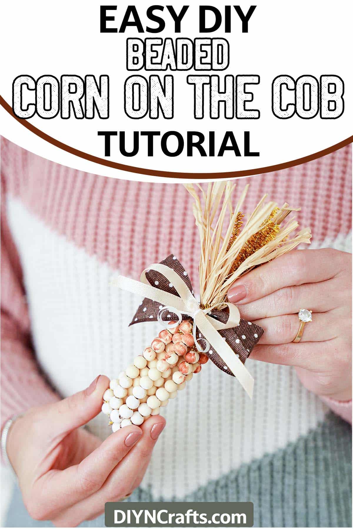 holding a simple fall craft with text which reads easy diy beaded corn on the cob tutorail