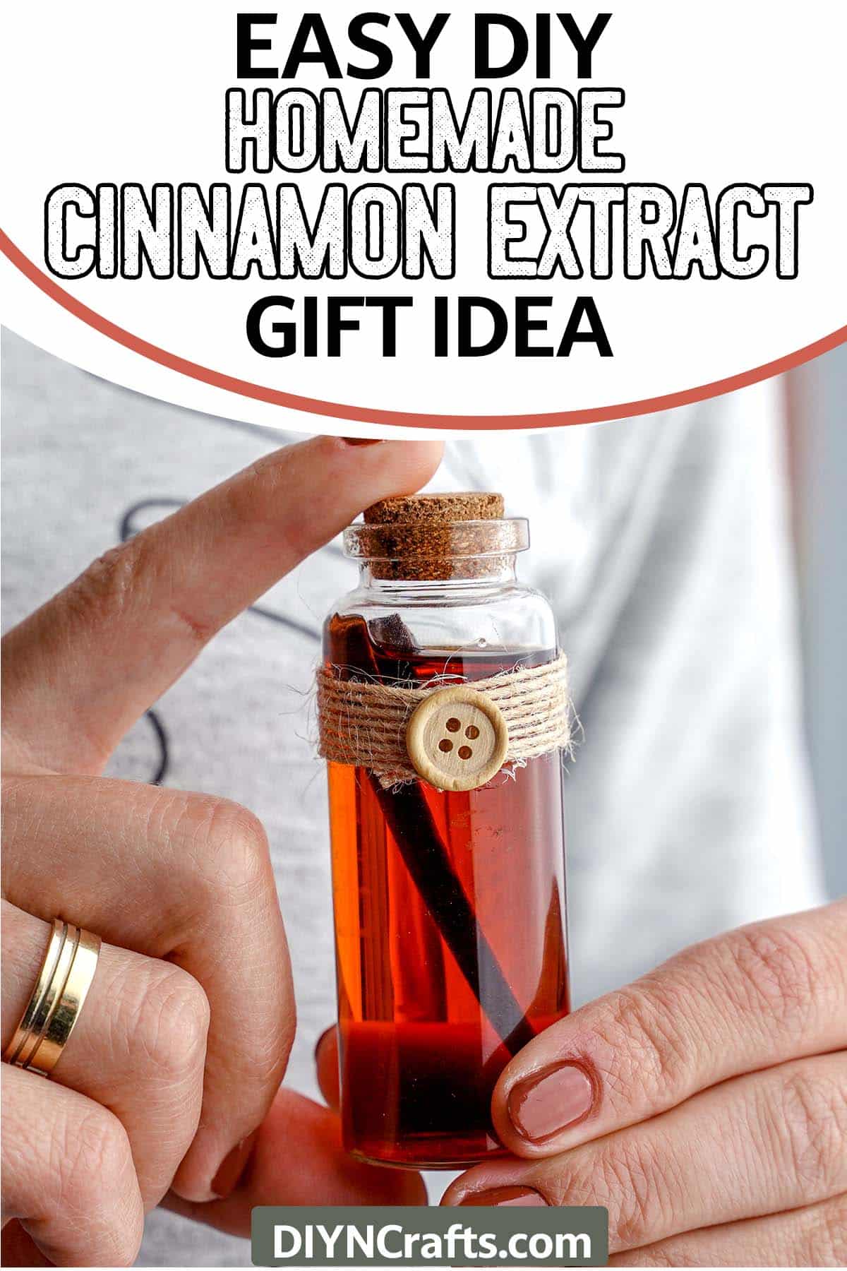holding a bottle of homemade cinnamon extract gift idea with text which reads easy diy homemade cinnamon extract gift idea