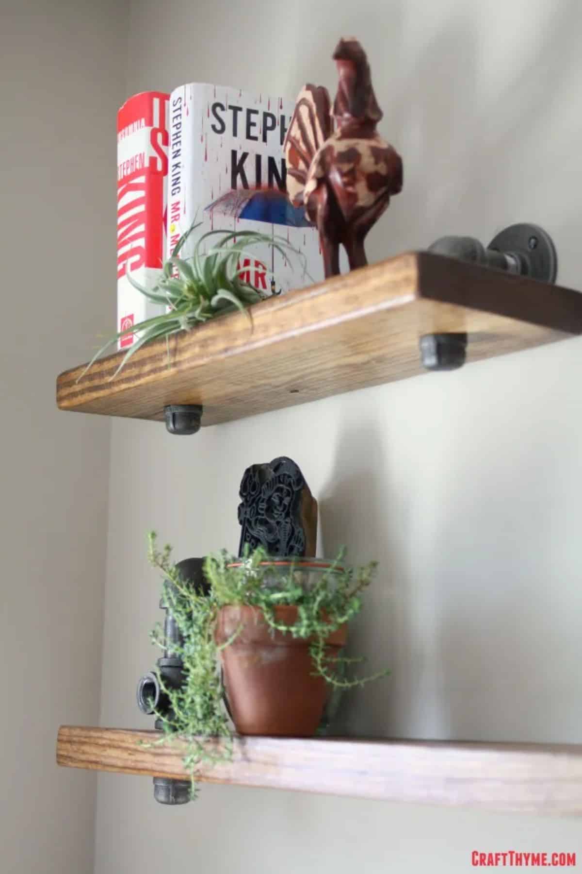 DIY Industrial Pipe Bookshelves With Black Iron Pipe And Spare Lumber