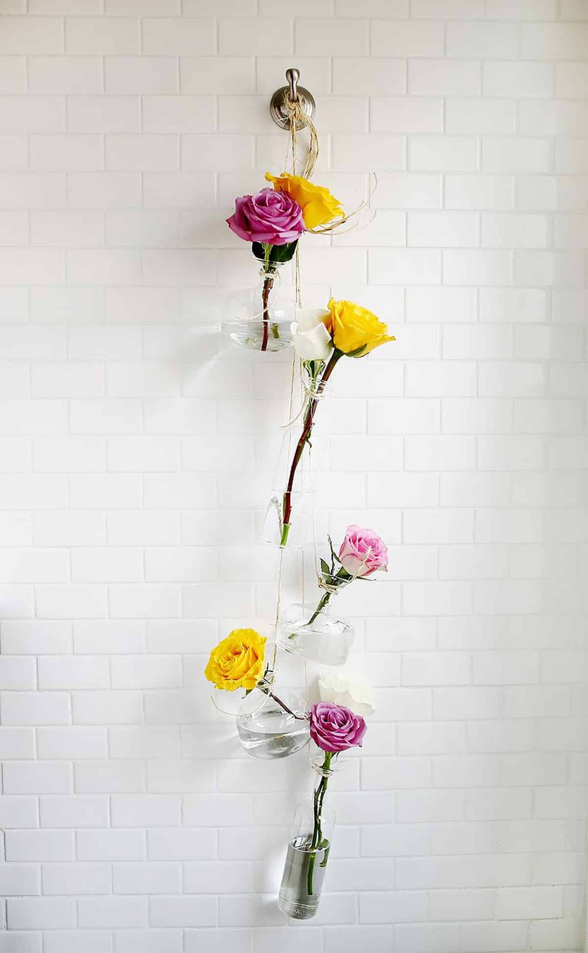 hanging vase display with flowers