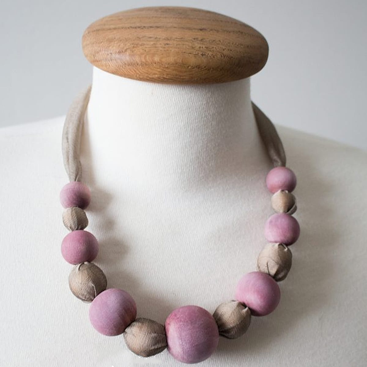 berry silk necklace worn on mannequin