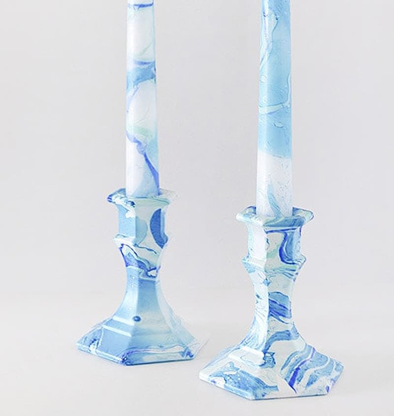 two blue marbling candle holders and candles