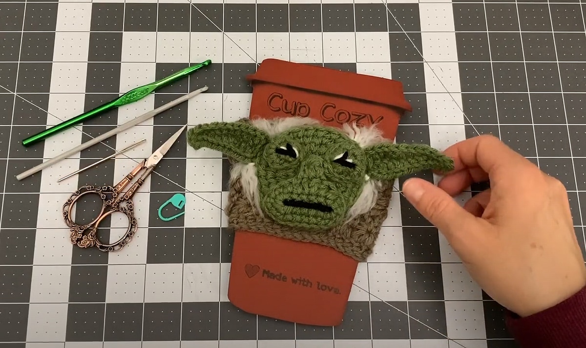 unique star wars-inspired coffee sleeve featuring yoda