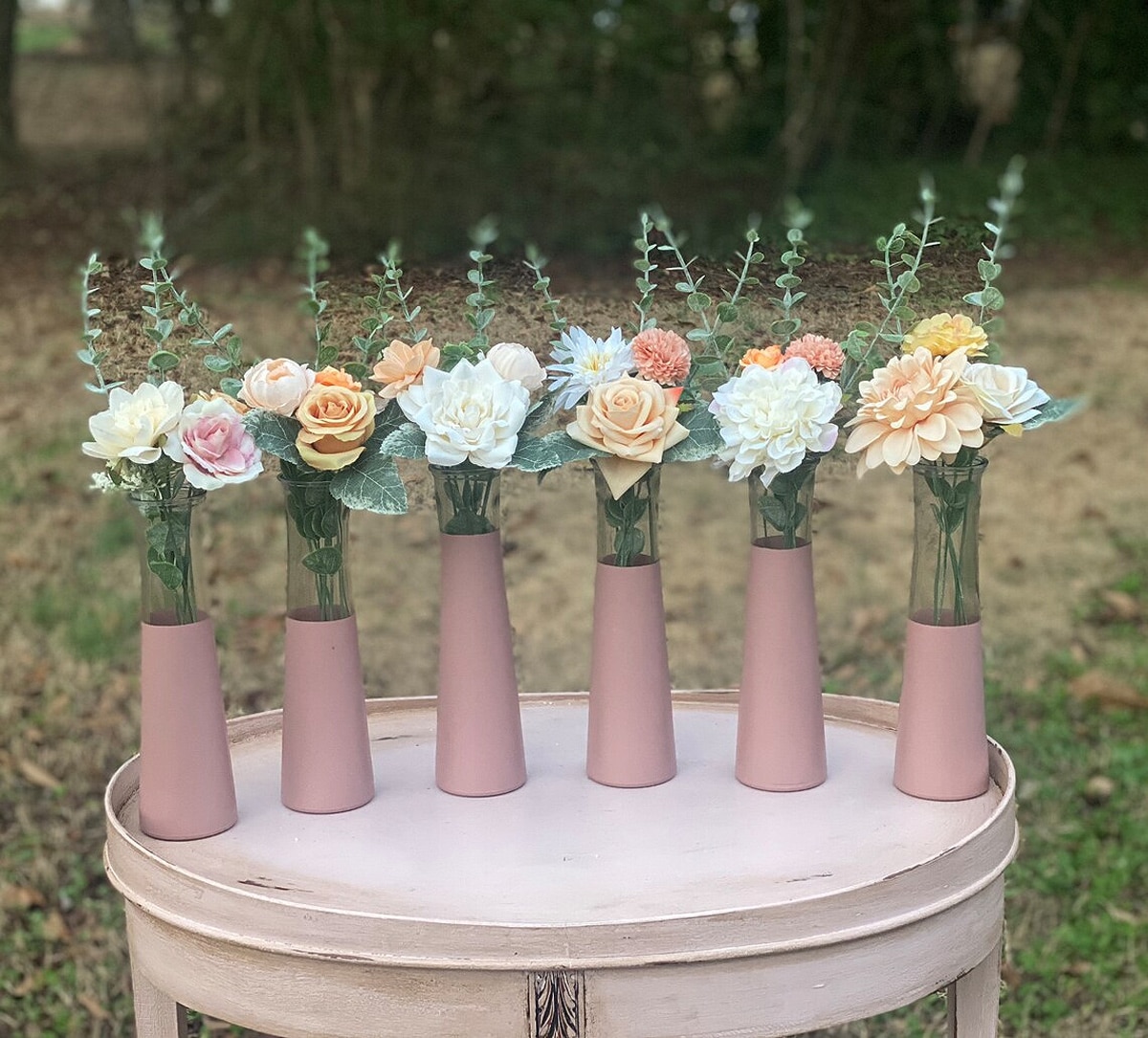 six blush bud vases