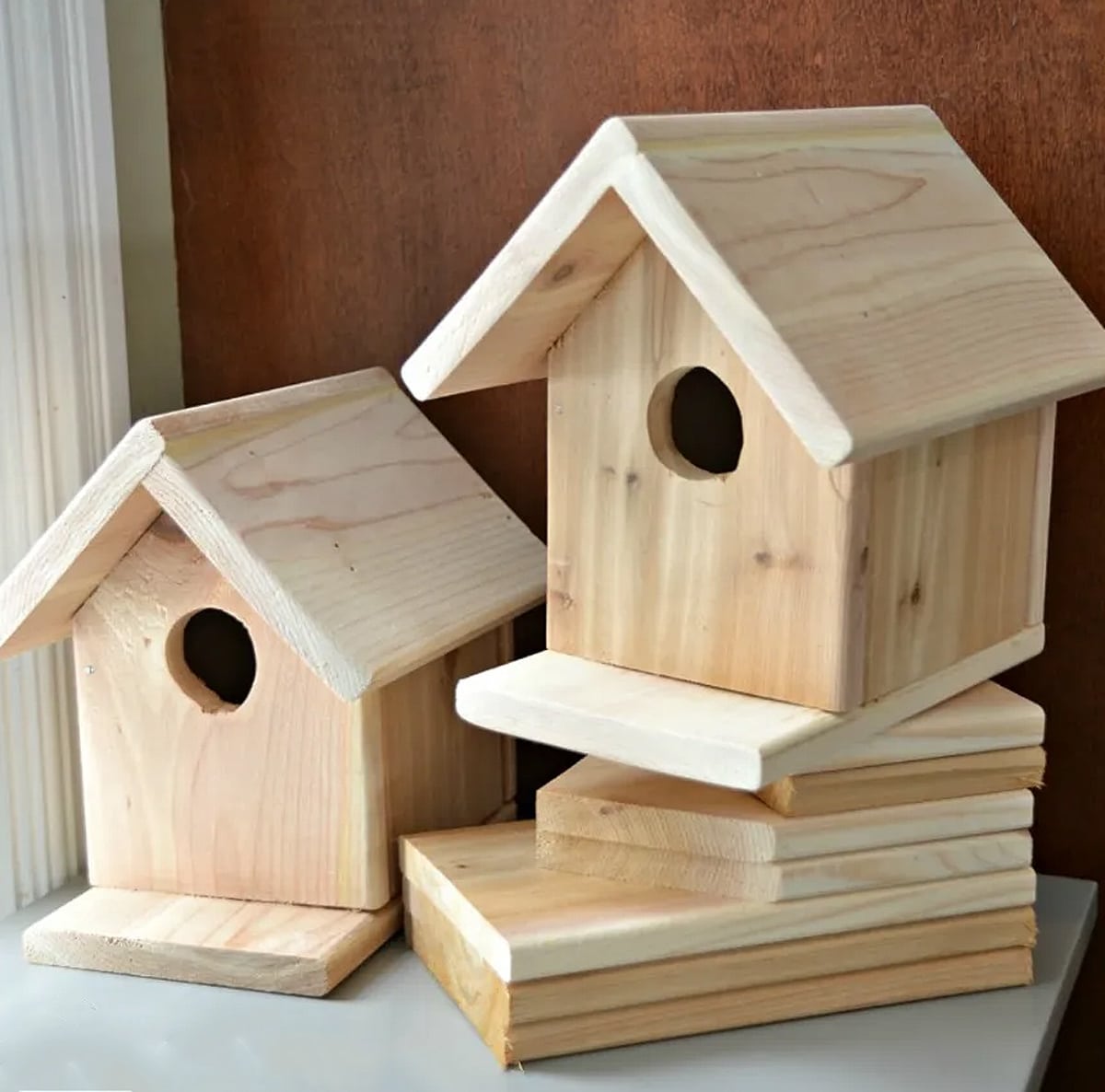 two wooden bird houses