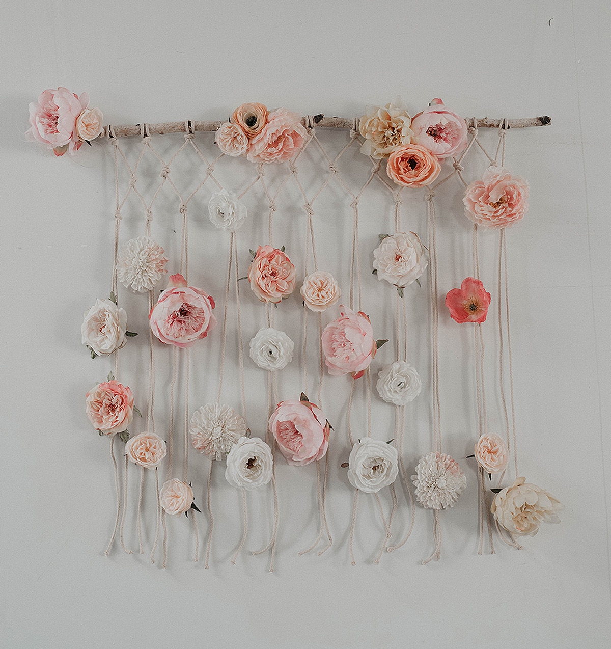 macramé wall hanging with flowers