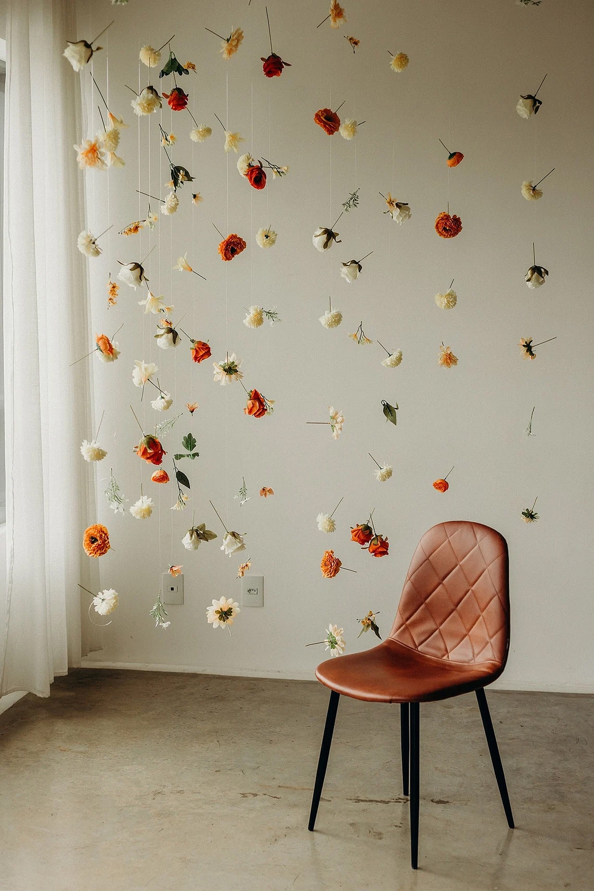 hanging flower decor and chair