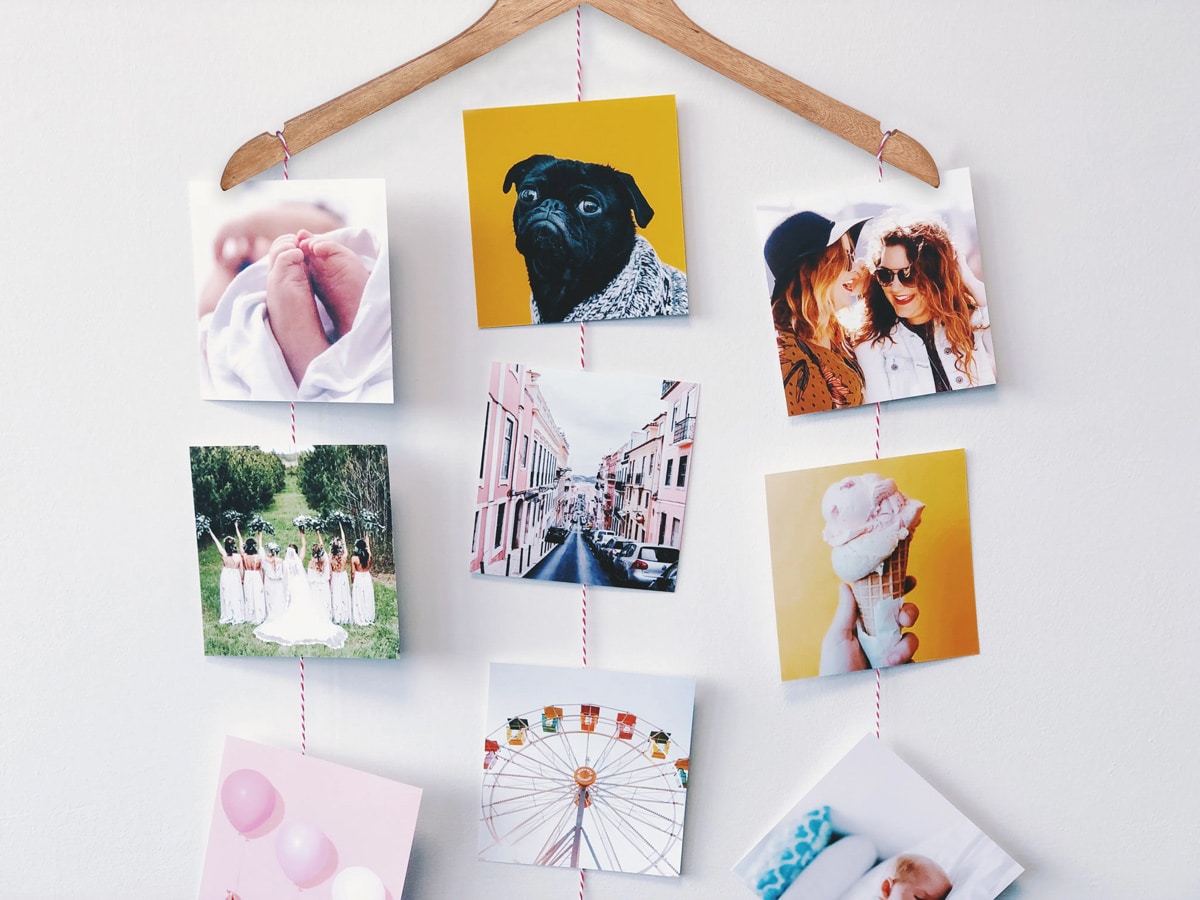 homemade photo hanger display using clothes hangers