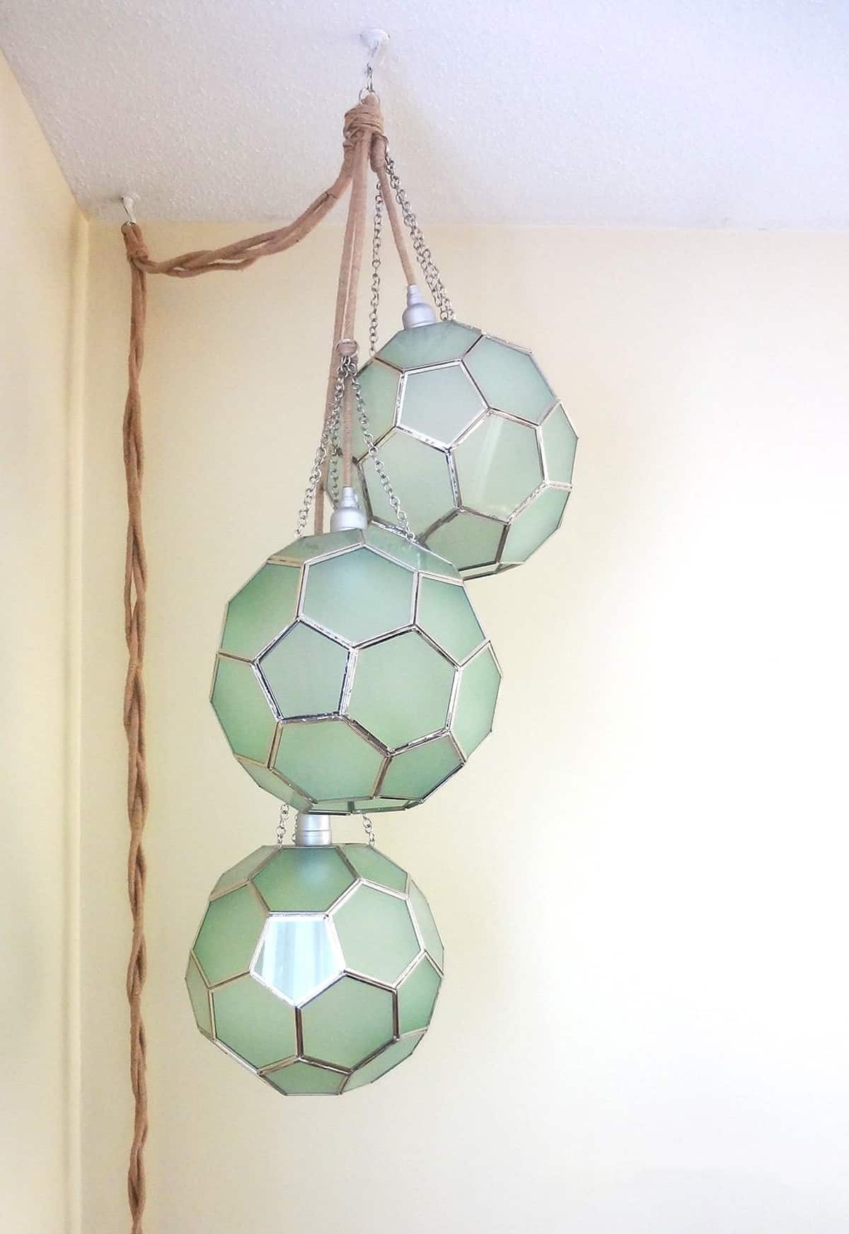 three honeycomb pendant lights