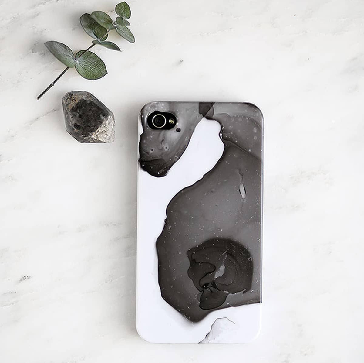 marbled phone case next to stone