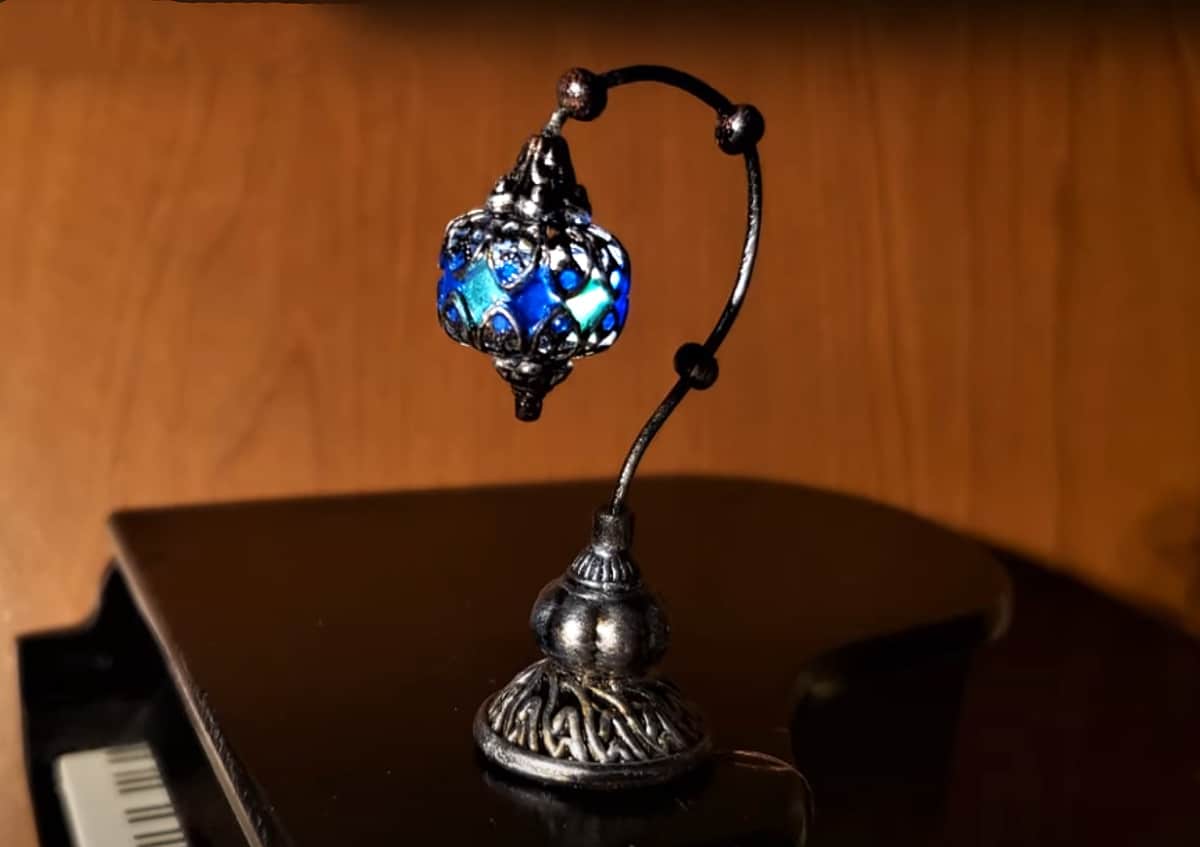 miniature mosaic lamp placed on piano