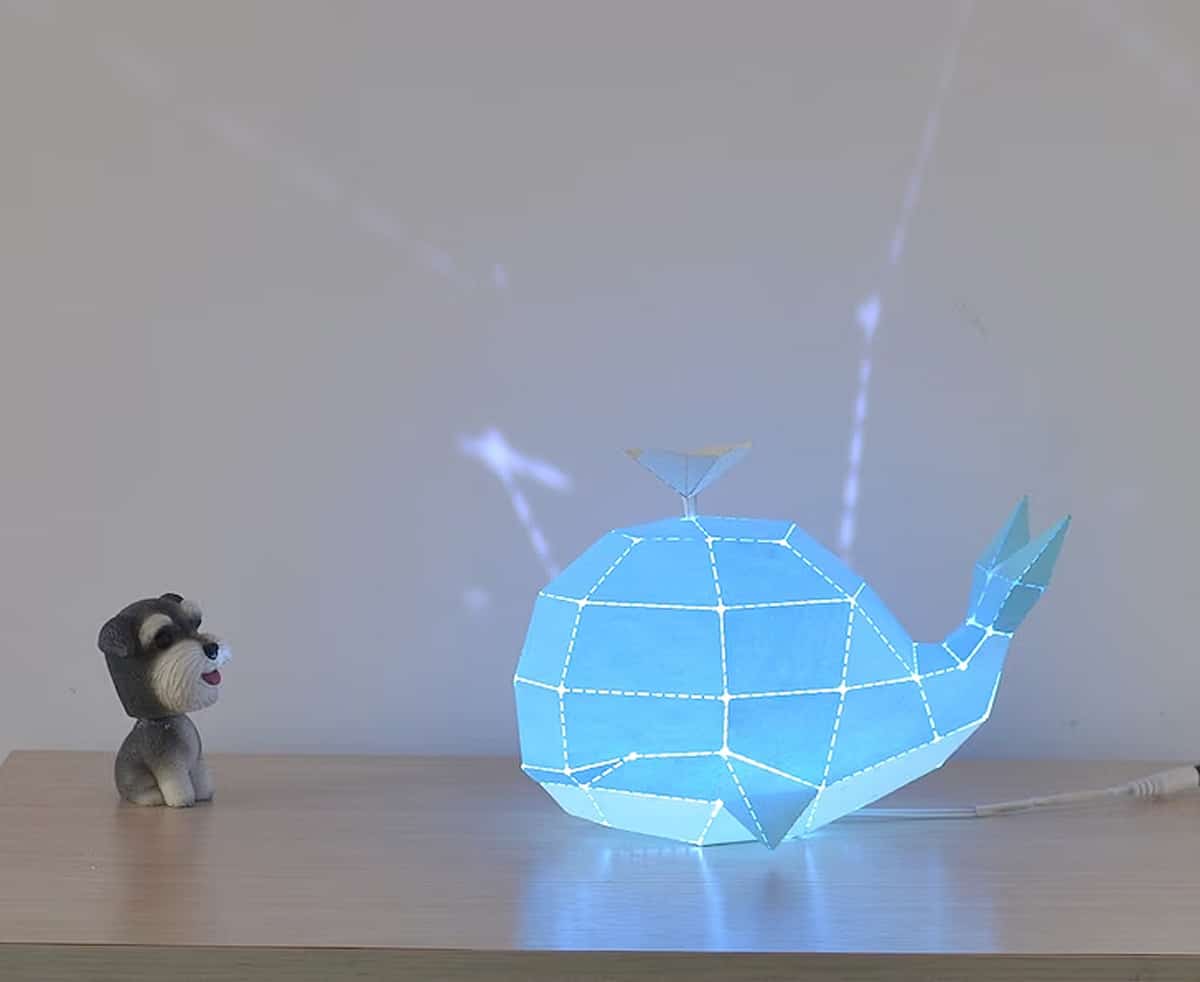 whale-shaped lamp next to dog model scene