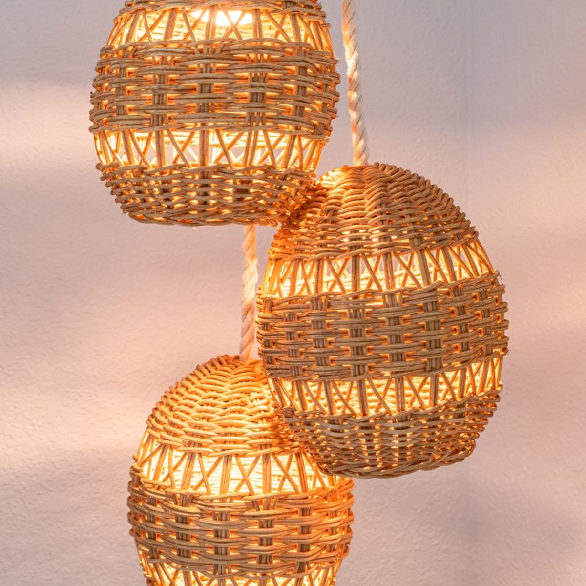 three woven hanging lamps