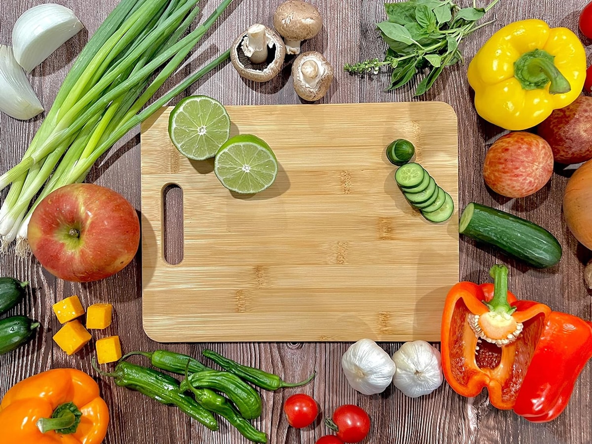 plain bamboo cutting board and vegetables