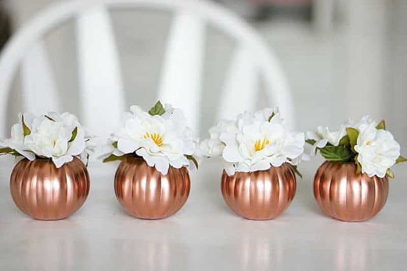 four pumpkin-shaped peace vases