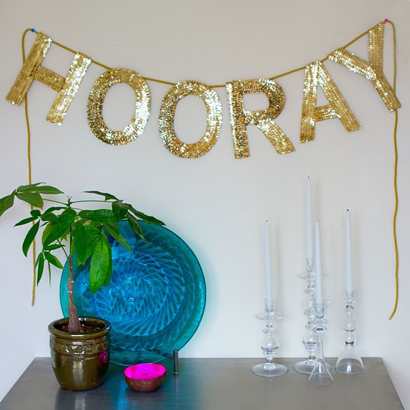 glittering gold "HOORAY" lettering and fixtures