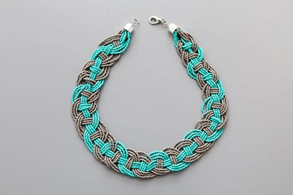 woven necklace on table