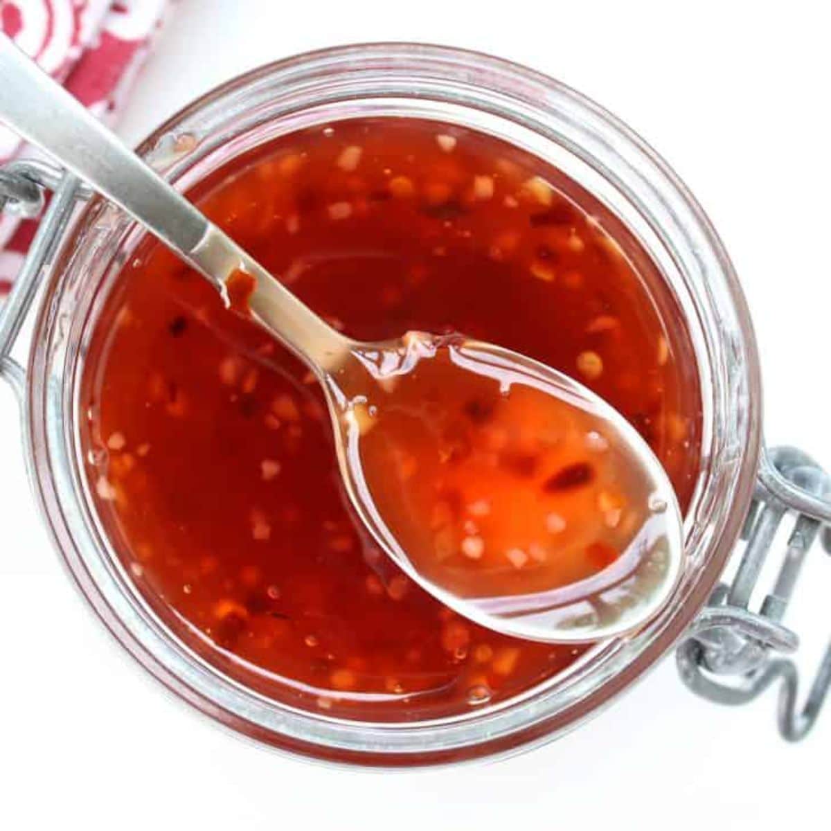 Sweet Chili Thai Hot Sauce in a glass jar.