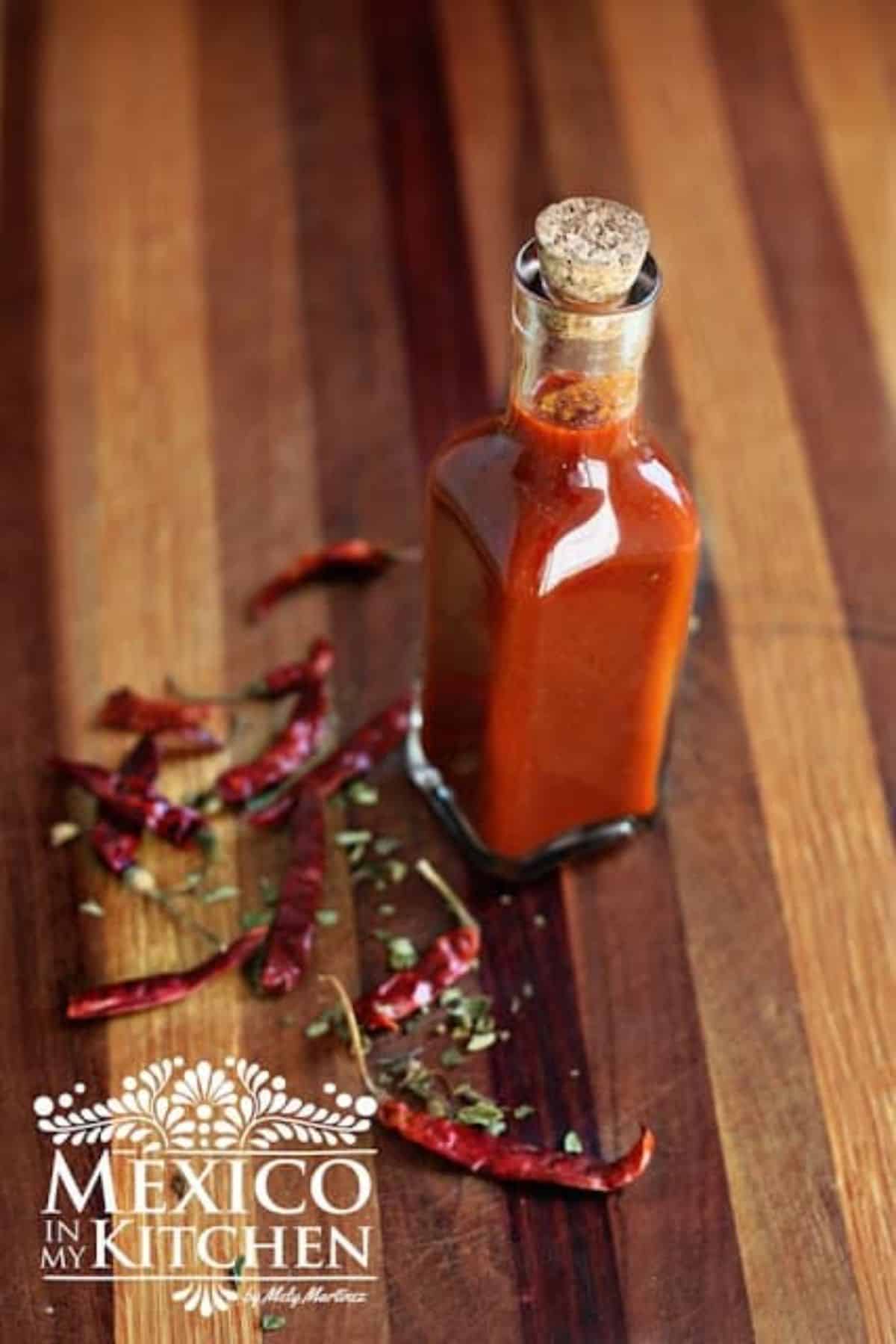 Homemade Red Hot Sauce in a glass bottle.