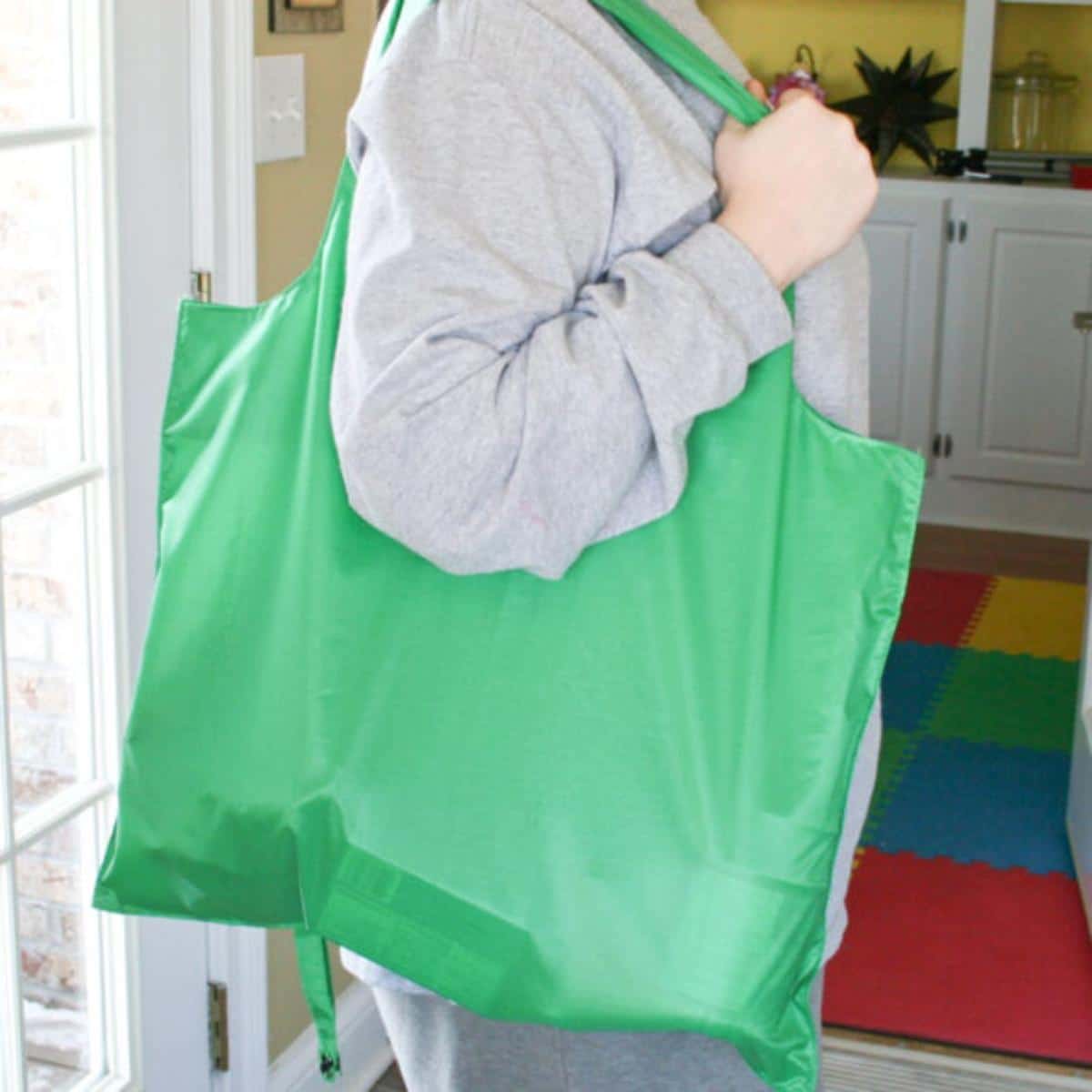 DIY Foldable Reusable Shopping Bag carried by a woman.